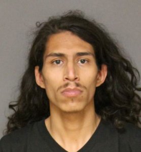 Luis Eduardo Munoz, 24, is seen in a booking photo released Nov. 1, 2018, by the Fullerton Police Department.