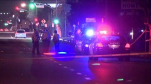 Detectives investigate the fatal shooting of a man at an auto body shop in the 400 block of West Redondo Beach Boulevard in Gardena on Nov. 2, 2018.