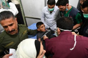 A Syrian boy receives treatment at a hospital in the regime controlled Aleppo on November 24, 2018. - Official Syrian media accused the armed opposition of launching an attack with 'toxic gas' on the northern city, but a leading rebel alliance has denied any involvement. (Credit: George Ourfalian/AFP/Getty Images)