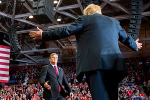 Donald Trump greets talk show host Sean Hannity at a Make America Great Again rally in Cape Girardeau, Missouri on Nov. 5, 2018. (Credit: by Jim Watson/AFP/Getty Images)