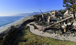 This photo shows the remains of a beachside luxury home along the Pacific Coast Highway community of Point Dume in Malibu on Nov. 11, 2018, as the battle to control the Woolsey Fire continues. (Credit: FREDERIC J. BROWN/AFP/Getty Images)