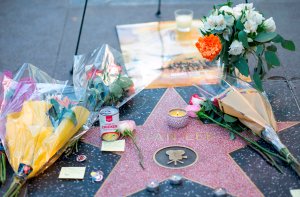 Fans leave tributes on Stan Lee's star on the Hollywood Walk of Fame shortly after the news that the Marvel founder died aged 95 was made public on Nov. 12, 2018. (Credit: Valerie Macon / AFP / Getty Images)