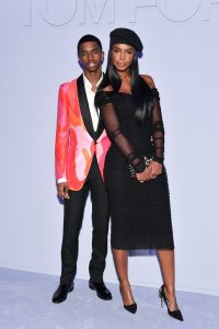 Christian Combs, left, and his mother Kim Porter attend the Tom Ford Women's Fall/Winter 2018 fashion show at Park Avenue Armory during New York Fashion Week on Feb. 8, 2018. (Credit: Dia Dipasupil / Getty Images)