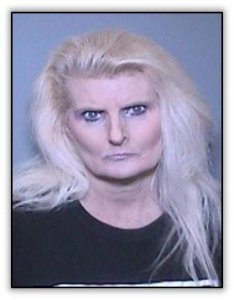 Denise Christine Latta, 54, of Huntington Beach, pictured in a booking photo released by the Tustin Police Department following her arrest on Nov. 29, 2018.