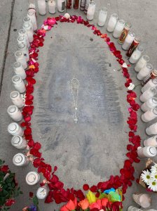 An unusual stain that bears a resemblance to the Virgin Mary is seen on a sidewalk in Artesia on Dec. 14, 2018, in a photo provided by the Holy Family Catholic Church.