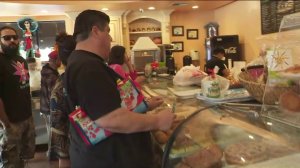 Customers line up for tamales at La Mascota Bakery in Boyle Heights on Christmas Eve, 2018.
