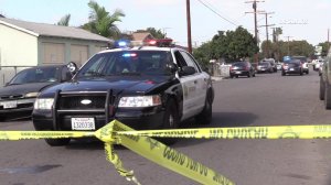 Homicide detectives investigate the fatal stabbing of a woman in the 15600 block of Frailey Avenue in Compton on Dec. 17, 2018.