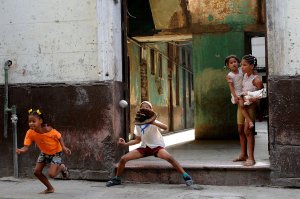 Cuban children play baseball in a street of Havana on Sept. 17, 2018. (Credit: YAMIL LAGE/AFP/Getty Images)