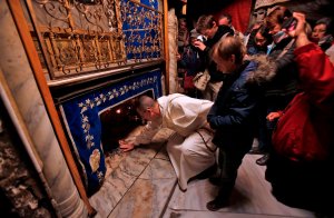 Christian pilgrims gather inside the Grotto, believed to be the exact spot where Jesus Christ was born, at the Church of the Nativity in the biblical West Bank city of Bethlehem, on Dec. 24, 2018, on the eve of the Christmas celebration. (Credit: MUSA AL SHAER/AFP/Getty Images)