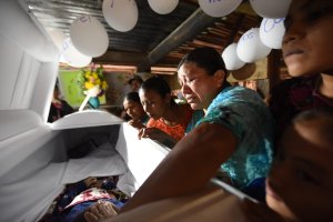 Relatives cry over the coffin of 7-year old Jakelin Caal during a wake in her home village 320 kilometers north of Guatemala City on Dec. 24, 2018. (Credit: JOHAN ORDONEZ/AFP/Getty Images)