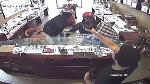 Surveillance cameras were rolling as two men, one of them armed with a knife, tried to rob a South Pasadena jewelry store on Dec. 14, 2018. One of the workers chased them off with a handgun. (Credit: South Pasadena Police Department)