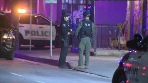 Police conduct a search for a group of robbery suspects who ran into a Hollywood neighborhood following a vehicle pursuit that began in Pasadena on Dec. 21, 2018.