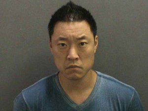 Edward Younghoon Shin, 41, is seen in a booking photo released by the Orange County District Attorney's Office on Dec. 7, 2018.