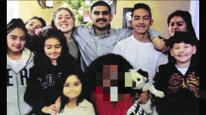 Francisco Garcia, center, is surrounded by loved ones in an undated photo released by his family.