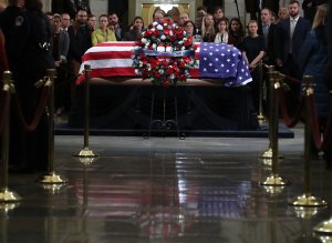 Mourners pay their respects in front of the casket of the late former President George H.W. Bush as he lies in state in the U.S. Capitol Rotunda, Dec. 4, 2018, in Washington, D.C. (Credit: Mark Wilson/Getty Images)