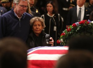 Jeb Bush and his wife Columba Bush pay their respects in front of the casket of the late former President George H.W. Bush as he lies in state in the U.S. Capitol Rotunda, Dec. 4, 2018, in Washington, D.C.(Credit: Mark Wilson/Getty Images)