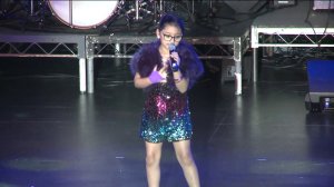 Kaylin Guevara sings on stage at the Orange County School of the Arts as she lived her dream of being a pop star for a day with help from the Make-A-Wish Foundation. (Credit: KTLA)