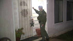 Authorities went door-to-door warning residents to evacuate the Laguna A zone on Jan. 17, 2019. (Credit: KTLA)