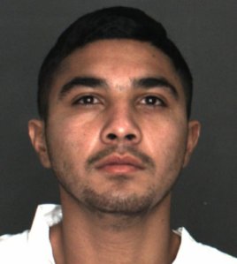 Flavio Hernandez is seen in a booking photo released by Rialto police.