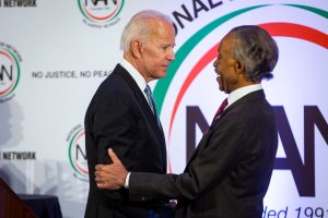 Former Vice President Joe Biden is greeted by Rev. Al Sharpton during the National Action Network Breakfast on Jan. 21, 2019, in Washington, D.C. (Credit: Al Drago/Getty Images)