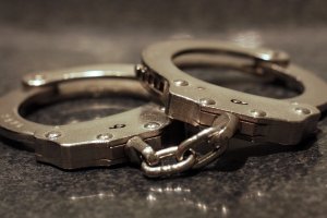 A pair of handcuffs is shown in a file image. (Credit: Moment via Getty Images)
