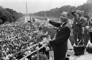 Civil rights leader Martin Luther King Jr. waves to supporters Aug. 28, 1963, on the National Mall in Washington, D.C. during the "March on Washington." (Credit: AFP/Getty Images)