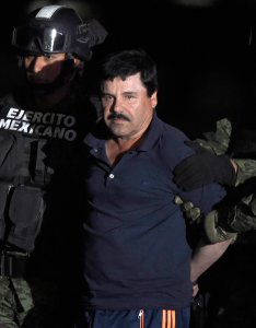 Drug kingpin Joaquin "El Chapo" Guzman is escorted into a helicopter at Mexico City's airport on Jan. 8, 2016, following his recapture during an intense military operation in Los Mochis, in Sinaloa State. (Credit: ALFREDO ESTRELLA/AFP/Getty Images)