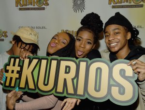 The Kelly family (from left) – Robert Jr., Andrea, Joann and Jaah – attend the Atlanta premiere Of Cirque du Soleil's "Kurios" on March 3, 2016. (Credit: Rick Diamond / Getty Images for Cirque du Soleil)