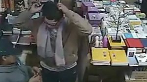 Two people who allegedly robbed victims at two Koreatown-area businesses in January 2019 are shown in video released by the Los Angeles Police Department.