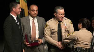 Caren Carl Mandoyan, second from left, looks on during L.A. County Sheriff Alex Villanueva's swearing-in ceremony in December 2018. (Credit: Mel Melcon / Los Angeles Times)