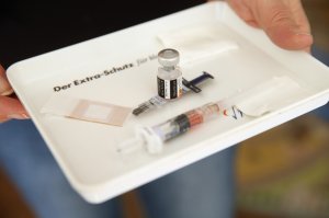 A doctor's assistant brings a tray with a vaccine against measles, rubella, mumps and chicken pox prior to the vaccination of an infant on February 26, 2015 in Berlin, Germany. (Credit: Sean Gallup/Getty Images)