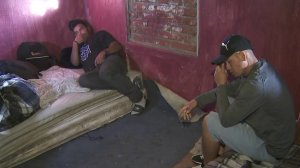 A group of migrants seeking legal entry into the U.S. are seen inside a shelter in Tijuana in January 2019. (Credit: KTLA)