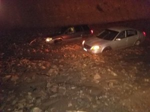 Two cars became stuck in a mudslide along Pacific Coast Highway in Malibu on Jan. 5, 2019. (Credit: Caltrans)