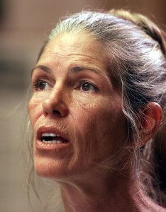 Leslie Van Houten, a former follower of Charles Manson, listens as former Deputy District Attorney Stephen Kay (not seen) describes the 1969 killing scene of the Smaldino couple during a parole hearing June 28, 2002, at the California Institution for Women in Corona. (Credit: DAMIAN DOVARGANES/AFP/Getty Images)