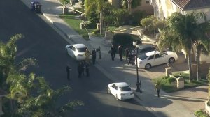 L.A. police and firefighters respond to a triple homicide in a gated community in Porter Ranch on Feb. 18, 2019. (Credit: KTLA)