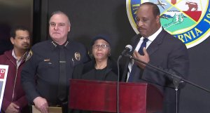 Left to right: Herbert Tillett, Inglewood Police Chief Mark Fronterotta and Ruth Tillett look on as Mayor James Butts speaks during a news conference on Feb. 20, 2019. (Credit: KTLA)
