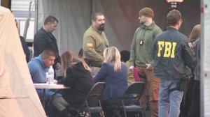 People arrested during a gang raid in the San Fernando Valley are shown on Feb. 13, 2019. (Credit: KTLA)