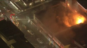 Firefighters respond to a blaze at a two-story commercial building in Sawtelle on Feb. 27, 2019.