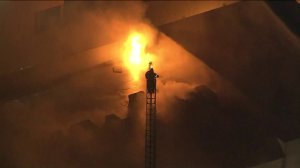Firefighters respond to a blaze at a two-story commercial building in Sawtelle on Feb. 27, 2019.