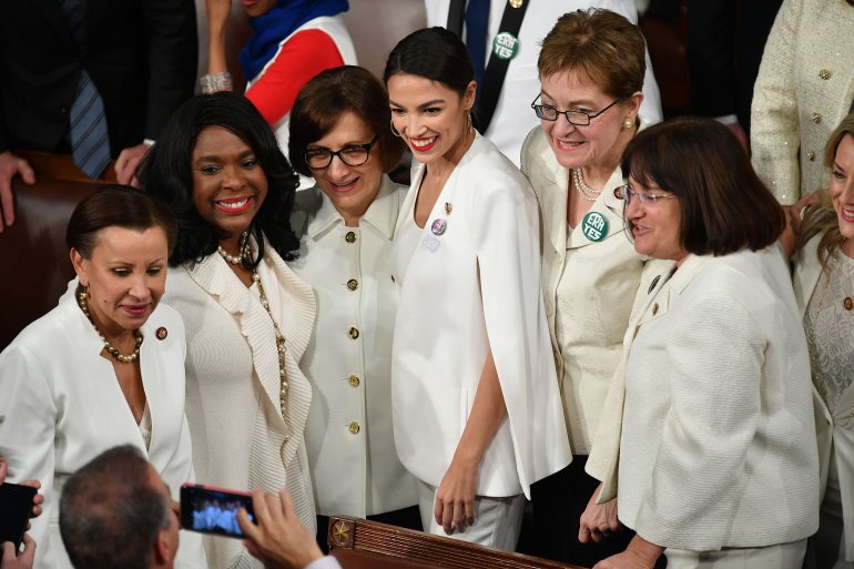New York Representative (D) Alexandria Octavio-Cortez (center) poses for a picture with other women ahead of President Donald Trump's State of the Union address at the U.S. Capitol in Washington, D.C., on Feb 5, 2019. (Credit: MANDEL NGAN/AFP/Getty Images)