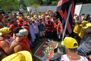 Brazilian football club Flamengo fans gather to lay flowers at the entrance of the club's training center after a deadly fire in Rio de Janeiro, Brazil, on Feb. 8, 2019. (Credit: Carl De Souza / AFP / Getty Images)