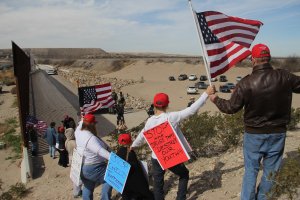 Dozens of people linked hands and formed a human wall to demonstrate in favor of the construction of the border wall between the United States and Mexico, at the border between Sunland Park, New Mexico on February 9, 2019. (Credit: HERIKA MARTINEZ/AFP/Getty Images)
