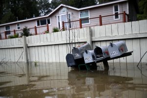 Mailboxes sit underwater in a flooded neighborhood of Forestville, California, on Feb. 27, 2019. (Credit: Justin Sullivan / Getty Images)