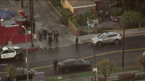 Police investigate the scene where a stolen car was recovered, with a kidnapped toddler inside, along Lincoln Boulevard in Venice on Feb. 2, 2019.