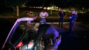 Officers from the Los Angeles Police Department's Metropolitan Division stop drivers and search their vehicles in November 2015. (Credit: Marcus Yam / Los Angeles Times)