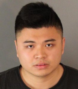 Li Haoming is seen in a booking photo released by Moreno Valley police. 