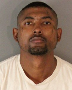 Carlos Romero, 31, is seen in a booking photo released Feb. 13, 2019, by the Riverside Police Department.
