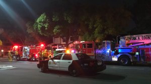 Firefighters work at the scene of a fatal condominium fire in Rosemead on Feb. 28, 2019. (Credit: L.A. County Fire Department)