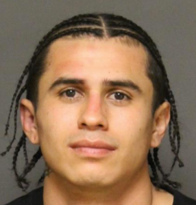 Christopher Solis appears in a booking photo provided by Fullerton police on Feb. 10, 2019. 