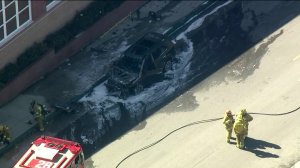 A police pursuit ended with a fiery crash in Whittier on Feb. 18, 2019, sending both a suspect and an uninvolved motorist to the hospital, officials said. (Credit: KTLA)